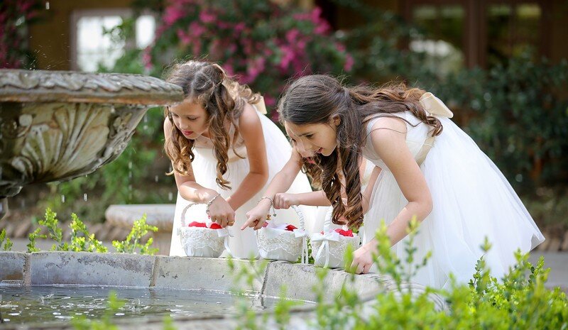 Photo of two flower girls outdoors