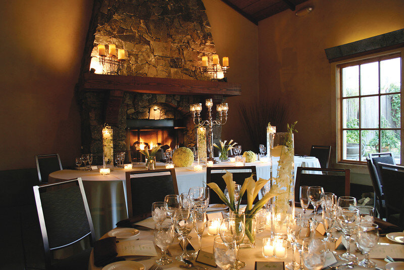 Photo of indoor wedding venue with table settings