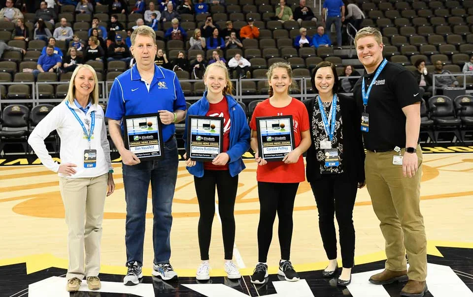 NCC Alum Jake Cain '11, an employee for St. Elizabeth presented the Unsung Hero Award to student recipients of Dixie High School.