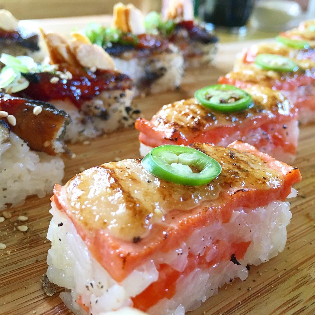 Salmon Oshi Sushi (Foreground) | Spicy Unagi Oshi Sushi (Background)
