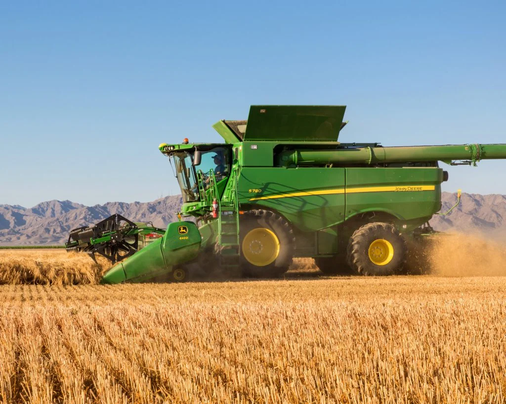 this is a generic image of a combine from machinefinder.com in case you aren't sure how wild they look.. Morgan was driving one that harvested green beans though, not grains.... now she is on a bike:)