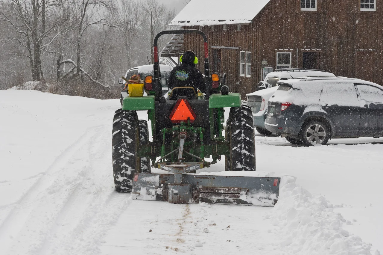 Ryan plowing the driveway, photo by Adam Ford