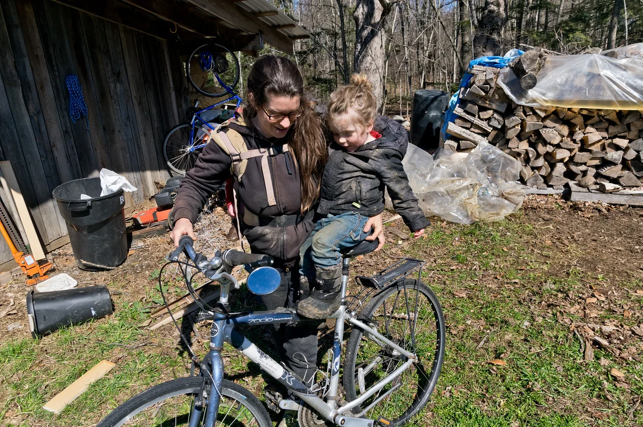 I was telling Sky about how in the future, mama will have to kick her car habit and get back on a bike more, so he wanted to try mama’s bike… Soraya was bored about the continued lessons in climate change, so she just snoozed on my back, photo by Adam Ford