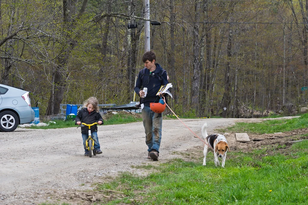Ry taking the kiddos and dog for a walk (Soraya is hiding on his back), photo by Adam Ford
