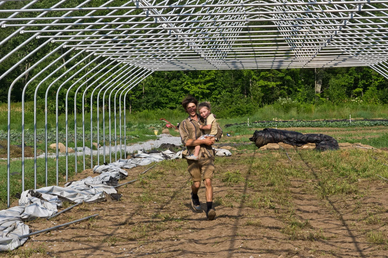 Sky running through the work site with Ryan, photo by Adam Ford