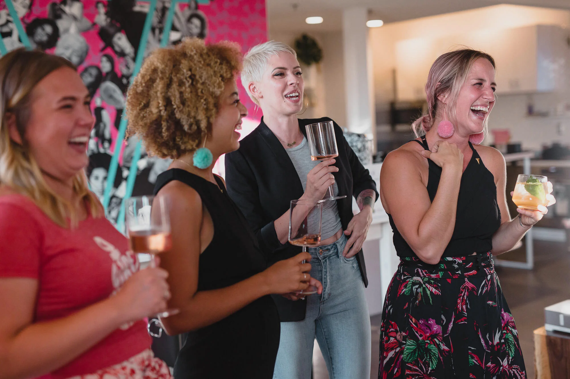  guests mingle and laugh at womxn’s event 