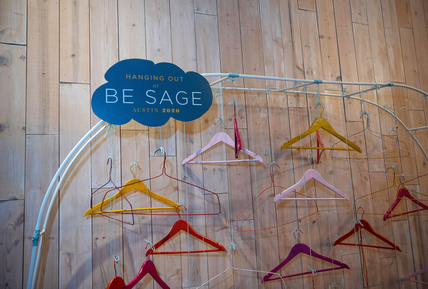  colorful wire and wooden hangar display 