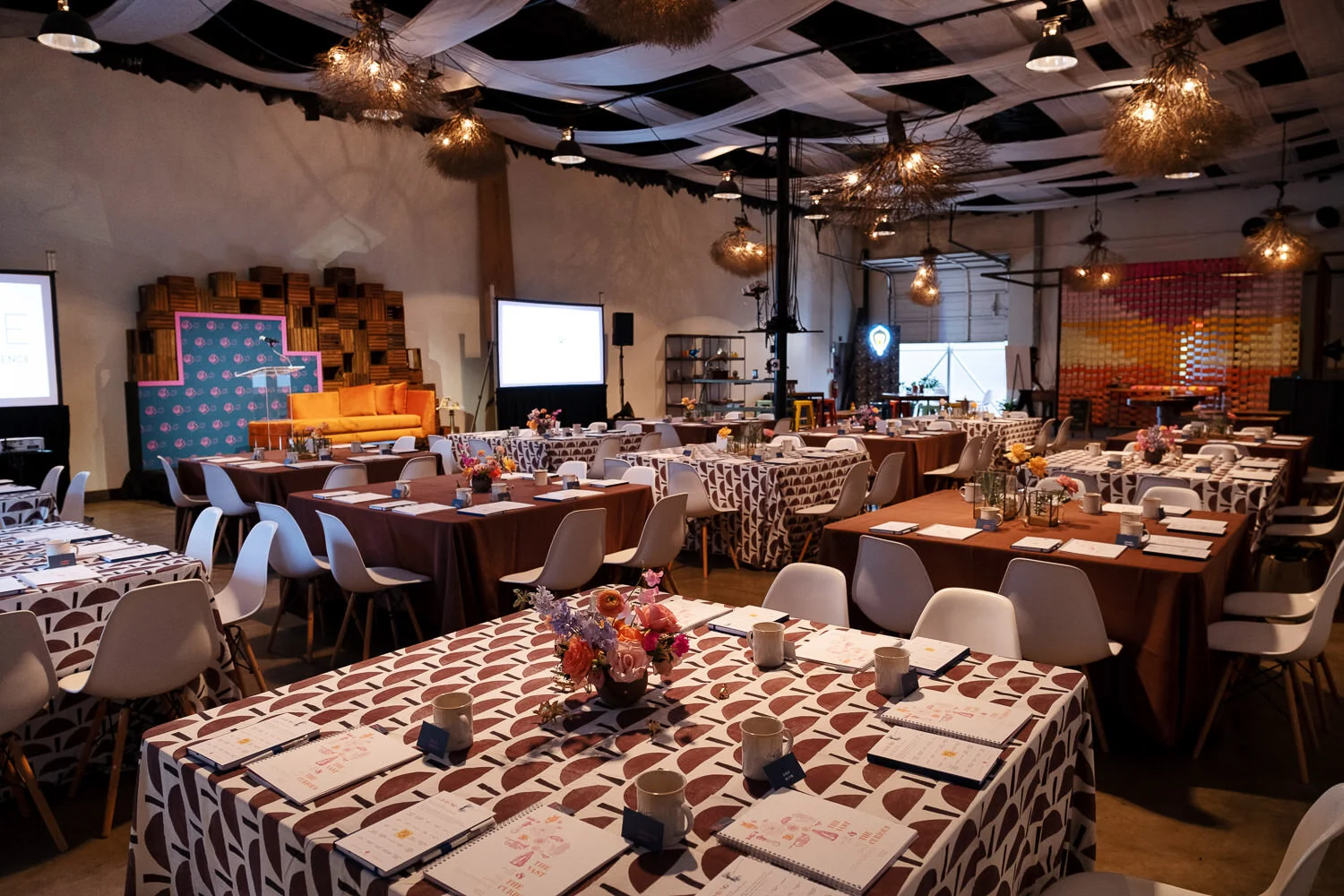  tablescapes with brown linens and white Eames chairs 