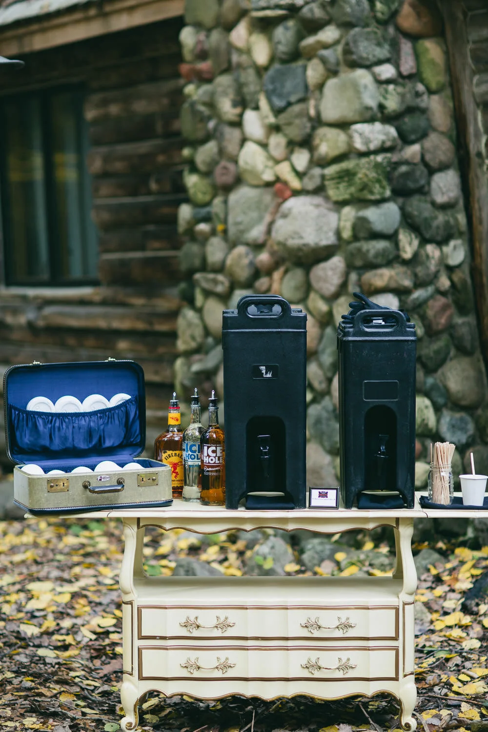  coffee setup with cups in vintage suitcase on vintage cream furniture 