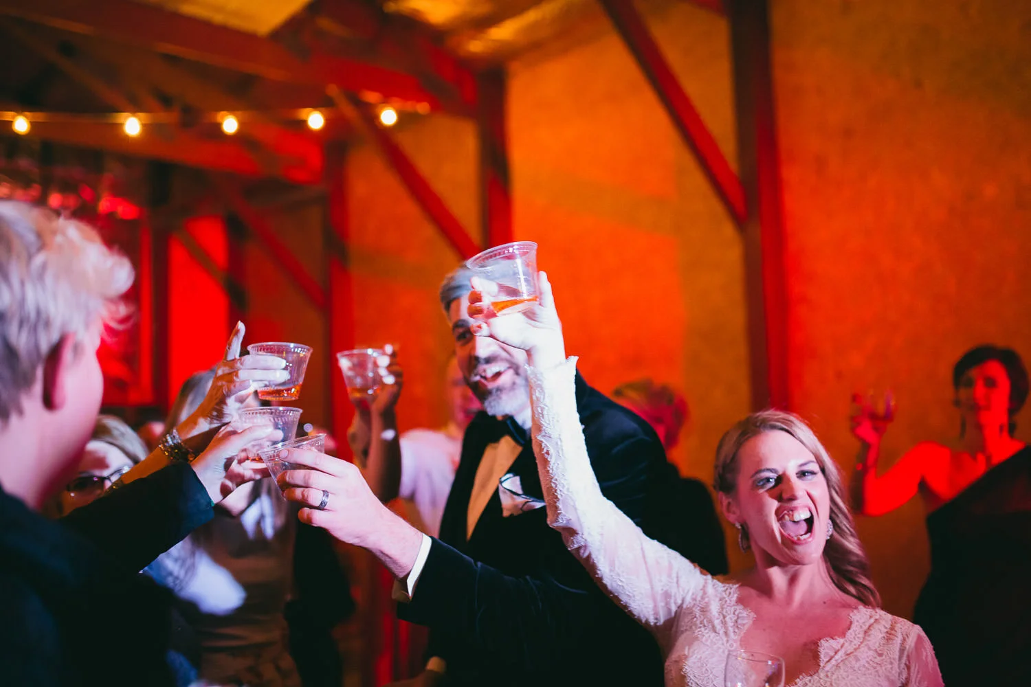  bride and groom cheer and celebrate  