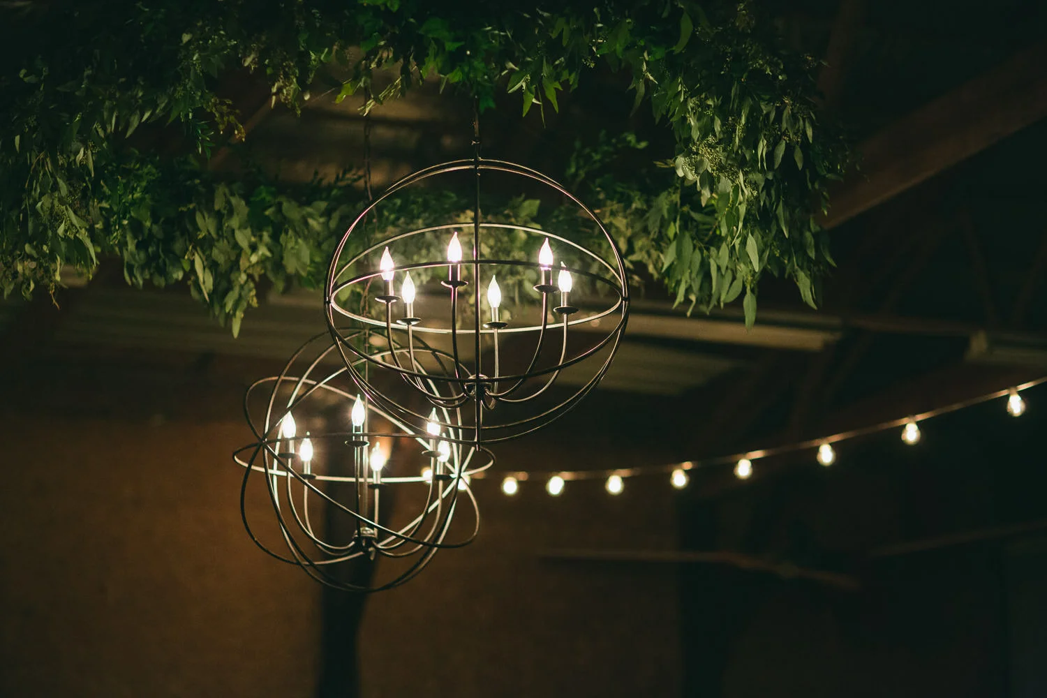  reception lighting of chandeliers in wire globes  