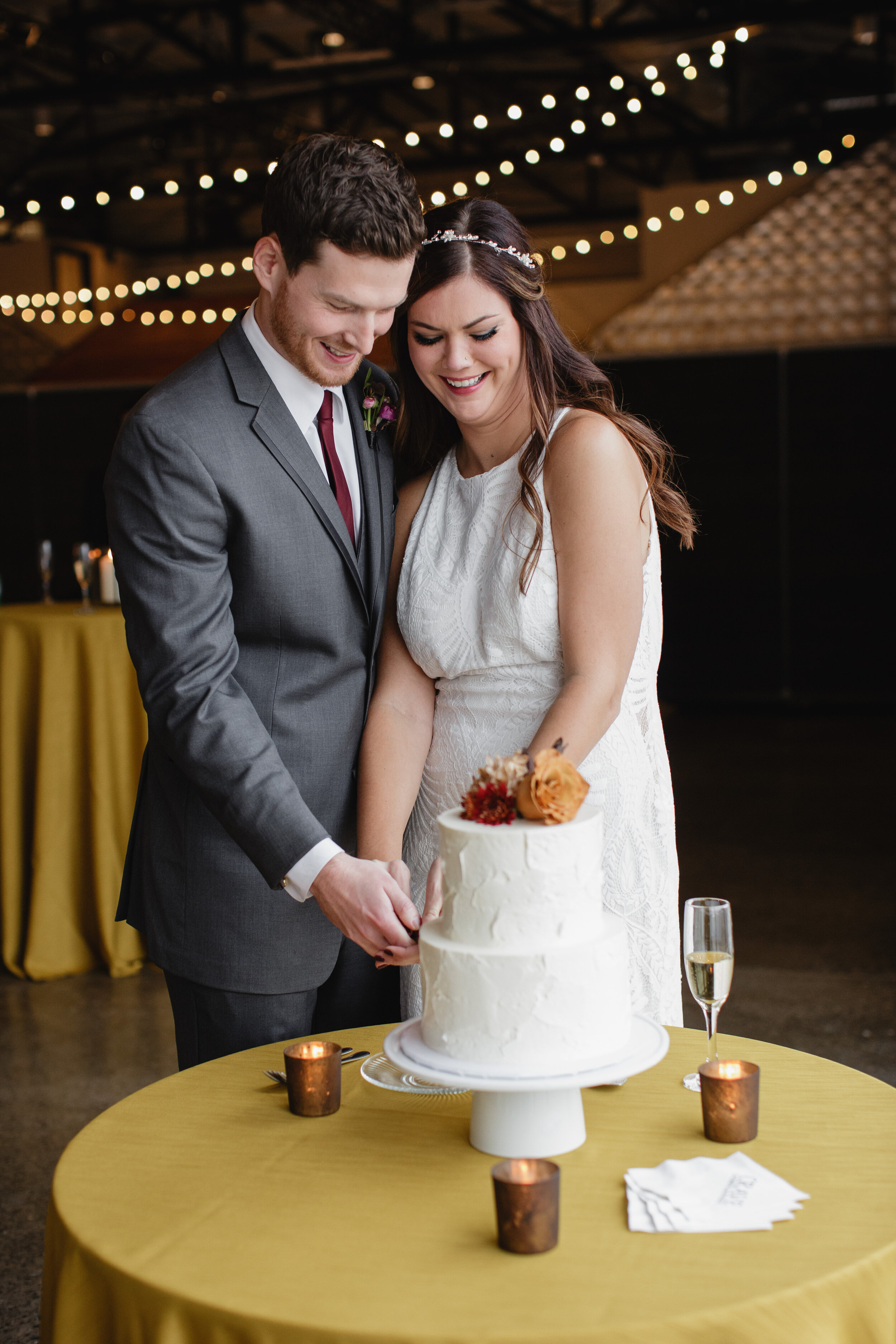 Bride and Groom cut cake at tiny wedding Quincy Hall MN