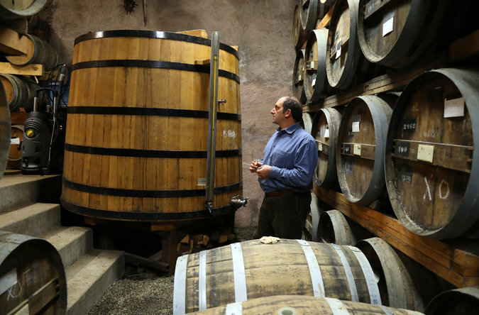 Mr. Farber, in the barrel aging room of his distillery, uses French-built Charentais stills and ages his brandy exclusively in French oak. Credit: Jim Wilson/The New York Times