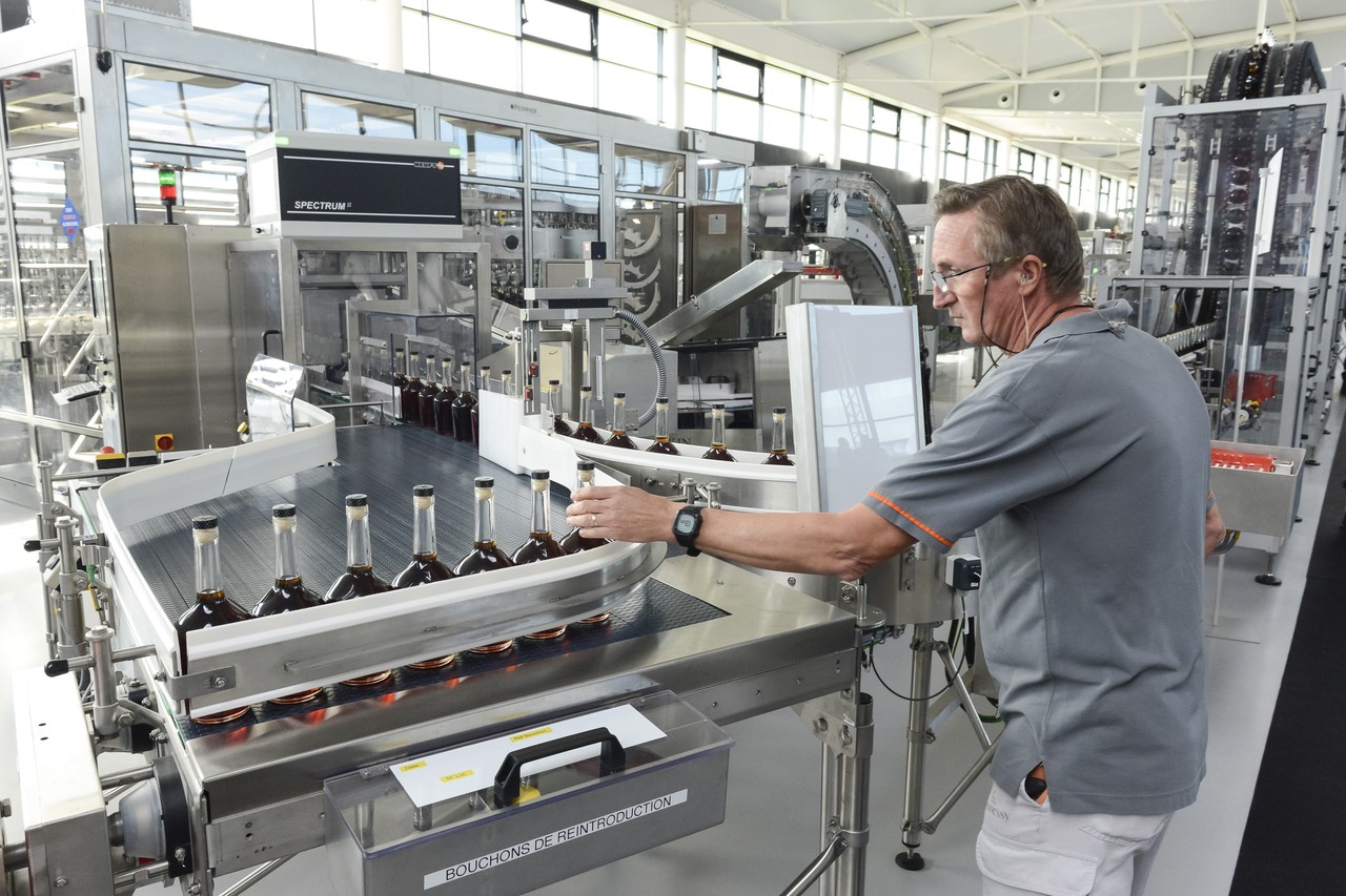  This month Hennessy opened a new plant that is expected to boost shipments by more than 14%. Bottles rattle along a conveyor belt at a rate of 20,000 an hour.  JULIEN FERNANDEZ FOR THE WALL STREET JOURNAL 
