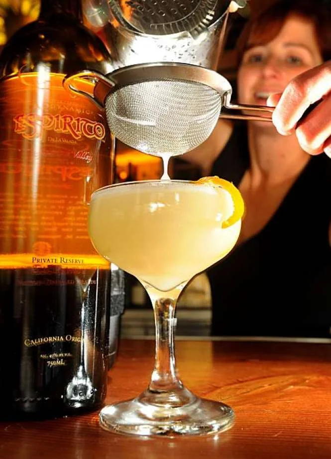 Photo: Noah Berger, Special To The Chronicle Michelle Fontana, a bartender at Gather, mixes a East India cocktail on Wednesday, Oct, 27, 2010, in Berkeley, Calif. At left is a bottle of Espirito de la Valada brandy.