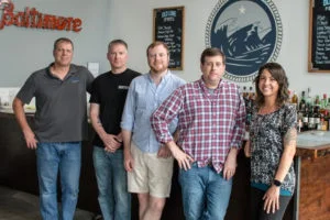Mark McLaughlin, center, with the Old Line Spirits team.