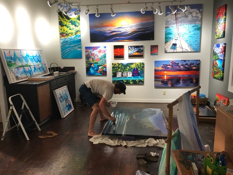 Here's Grant Peacoff putting a final varnish on his new piece.