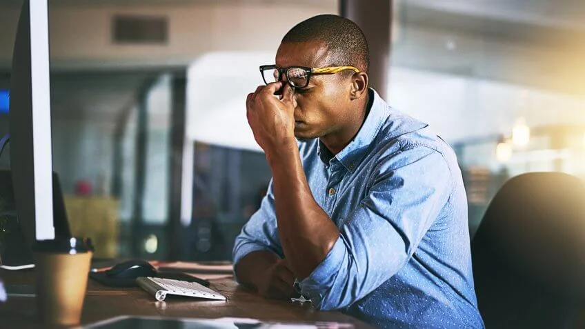 hardworking-man-late-in-office-iStock-936117884-848x477.jpg