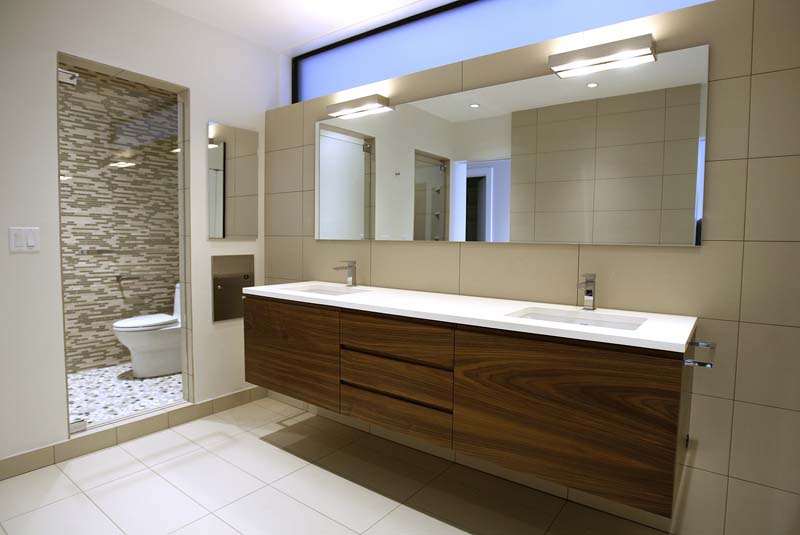 Mohawk Vanities Flat cut walnut vanities with integrated finger pulls, natural lacquer finish.