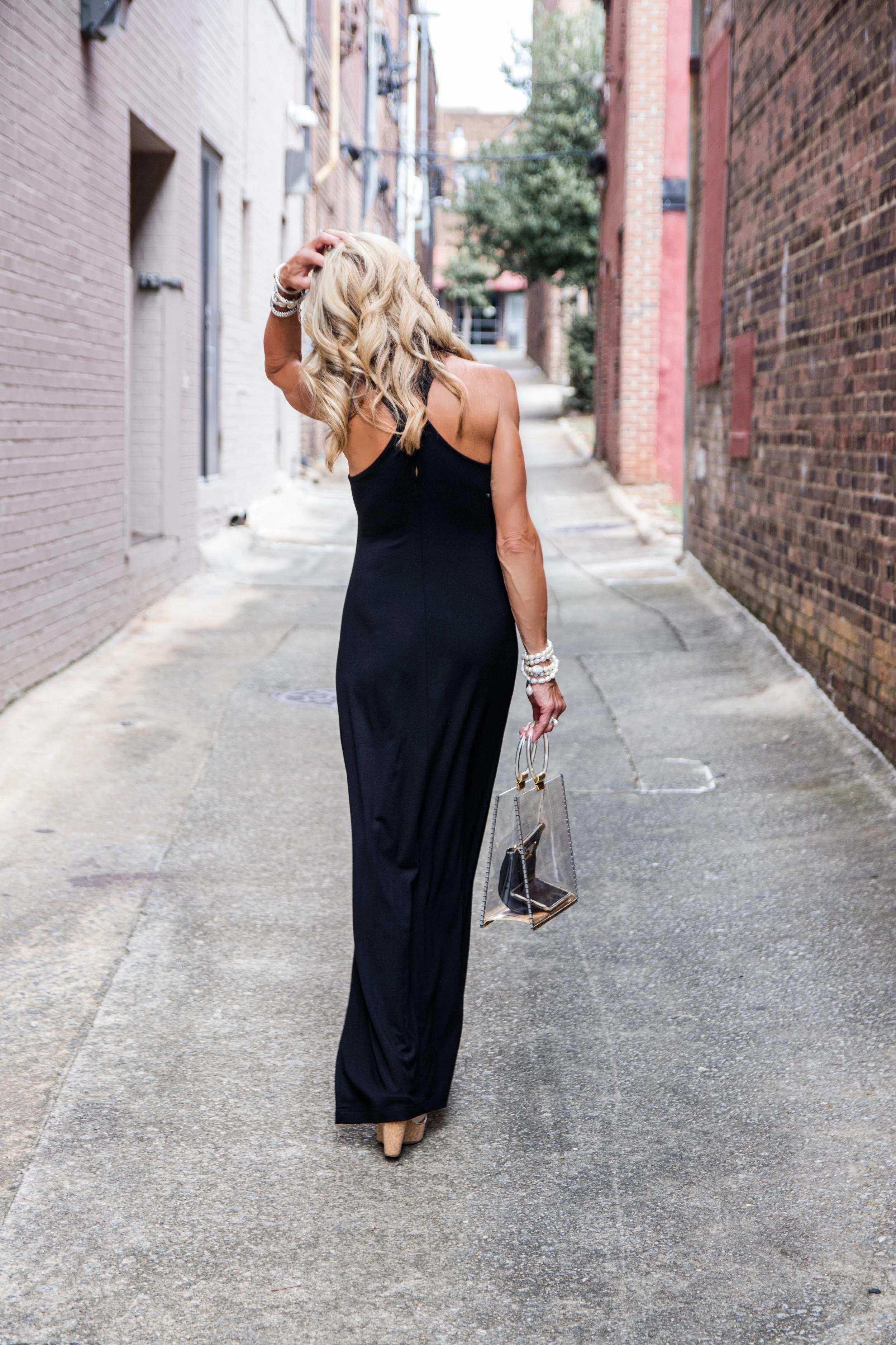 black dress with denim jacket An Elevated Casual Go-To Outfit: This Black Midi Dress