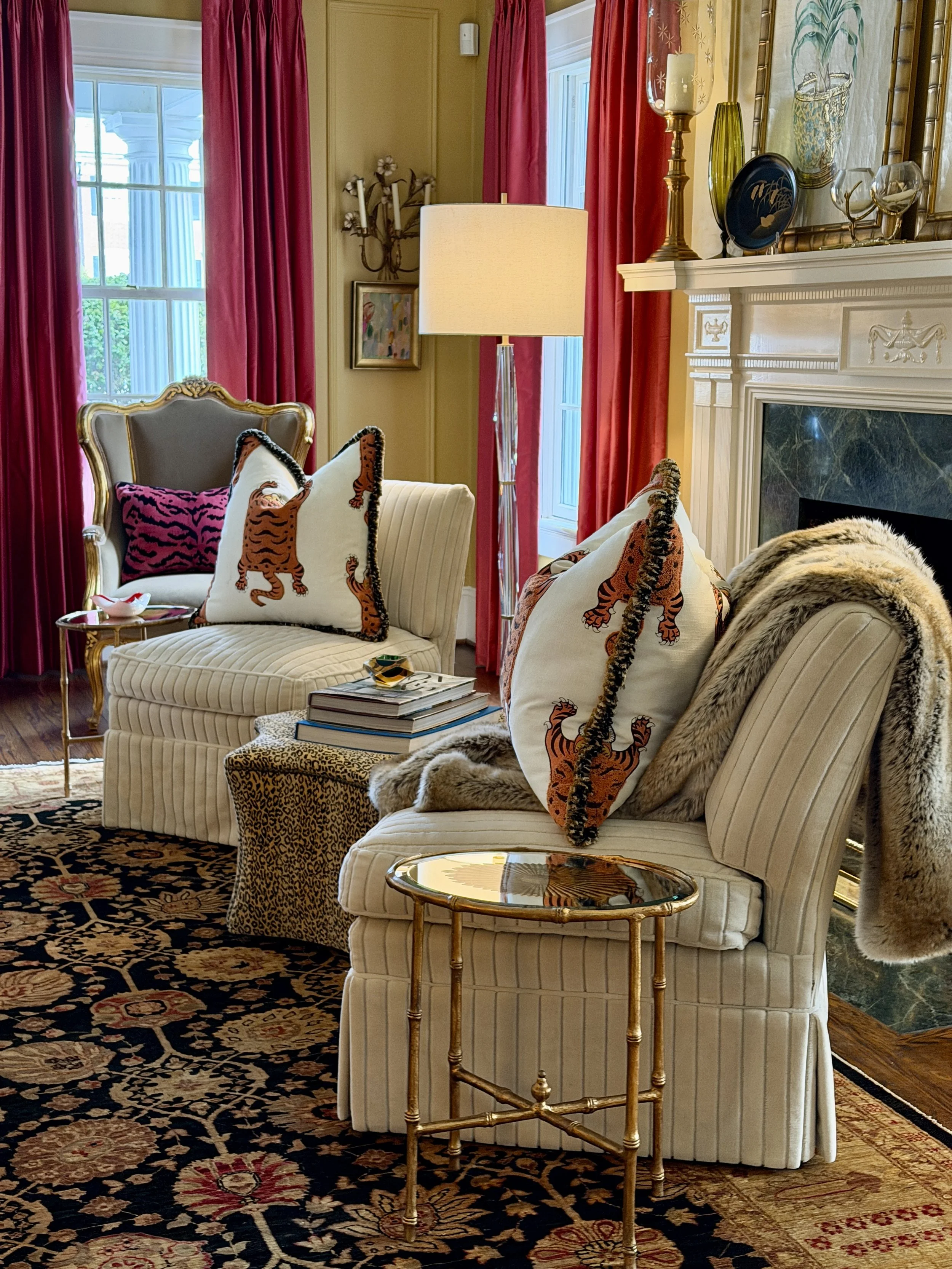   We just replaced the window treatments in the living room and hung these gorgeous pink silk panels.  They make the whole room feel so much richer and cozier.  The pillows on the white chairs are made with Schumacher Jokhang Tiger Velvet.  