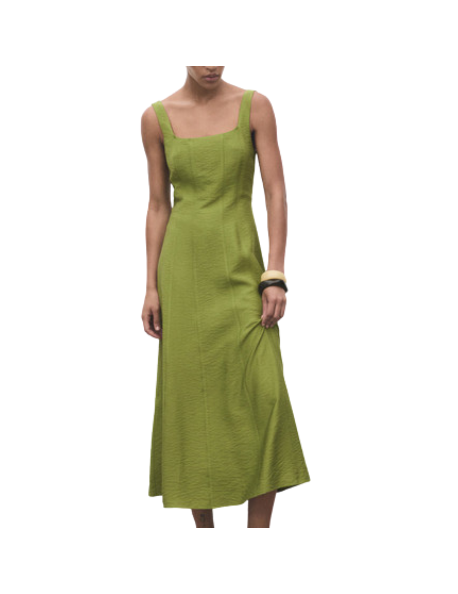 Green sleeveless dress on a woman with bracelets, against a white background.