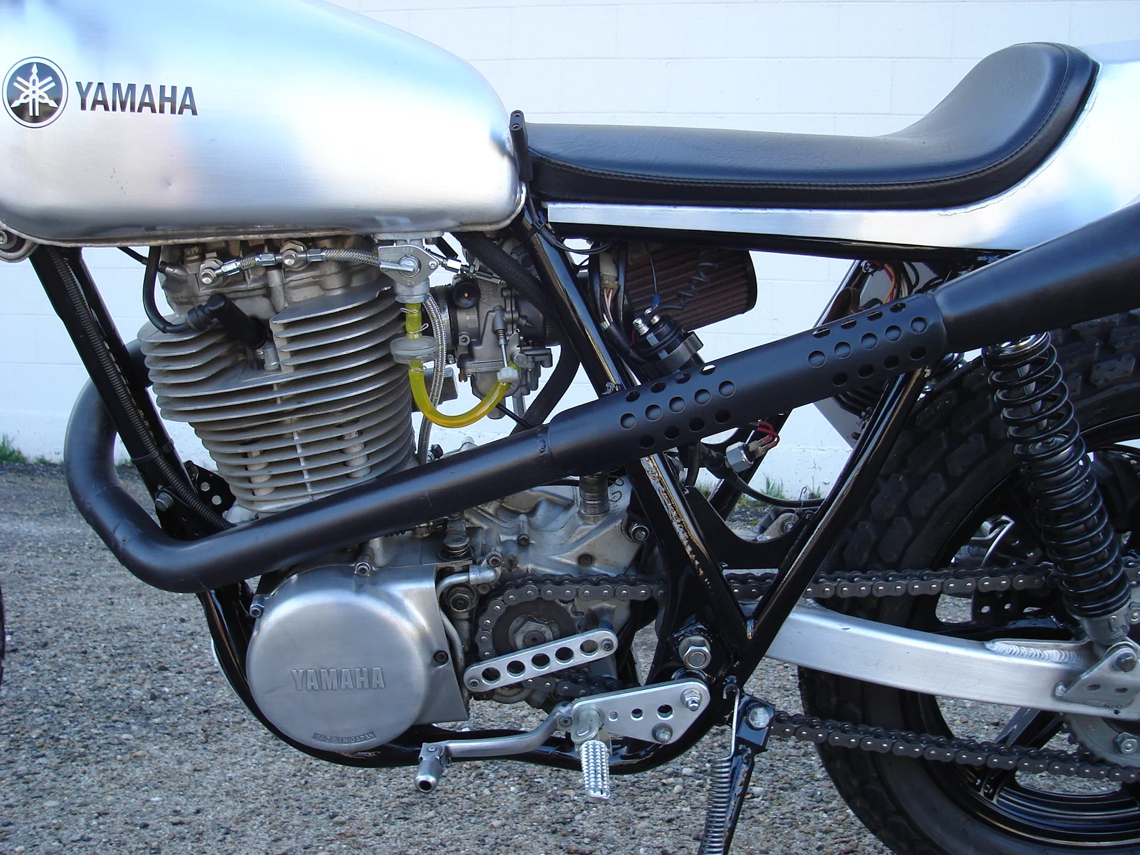 HAND BUILT (WRONG SIDE) EXHAUST, CUSTOM FOOT PEG MOUNTS, R-1 FOOTPEGS