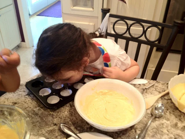 Cleaning up the drips on the pan before baking..