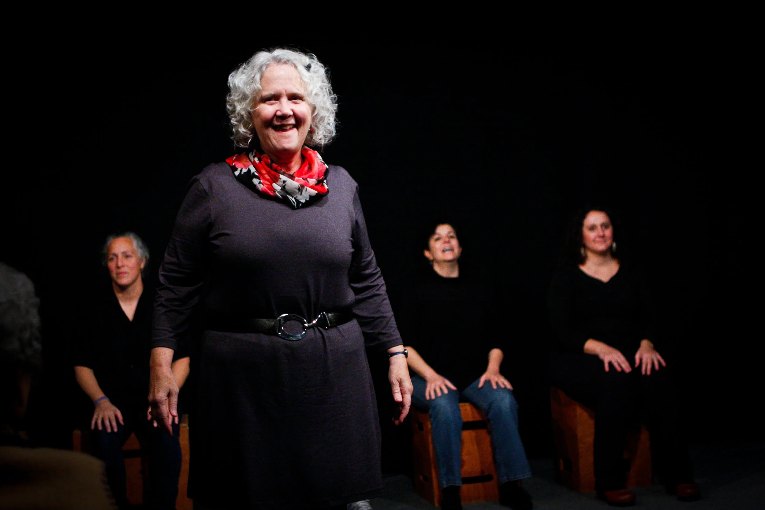 Gracie conducts the cast and facilitates the storytelling