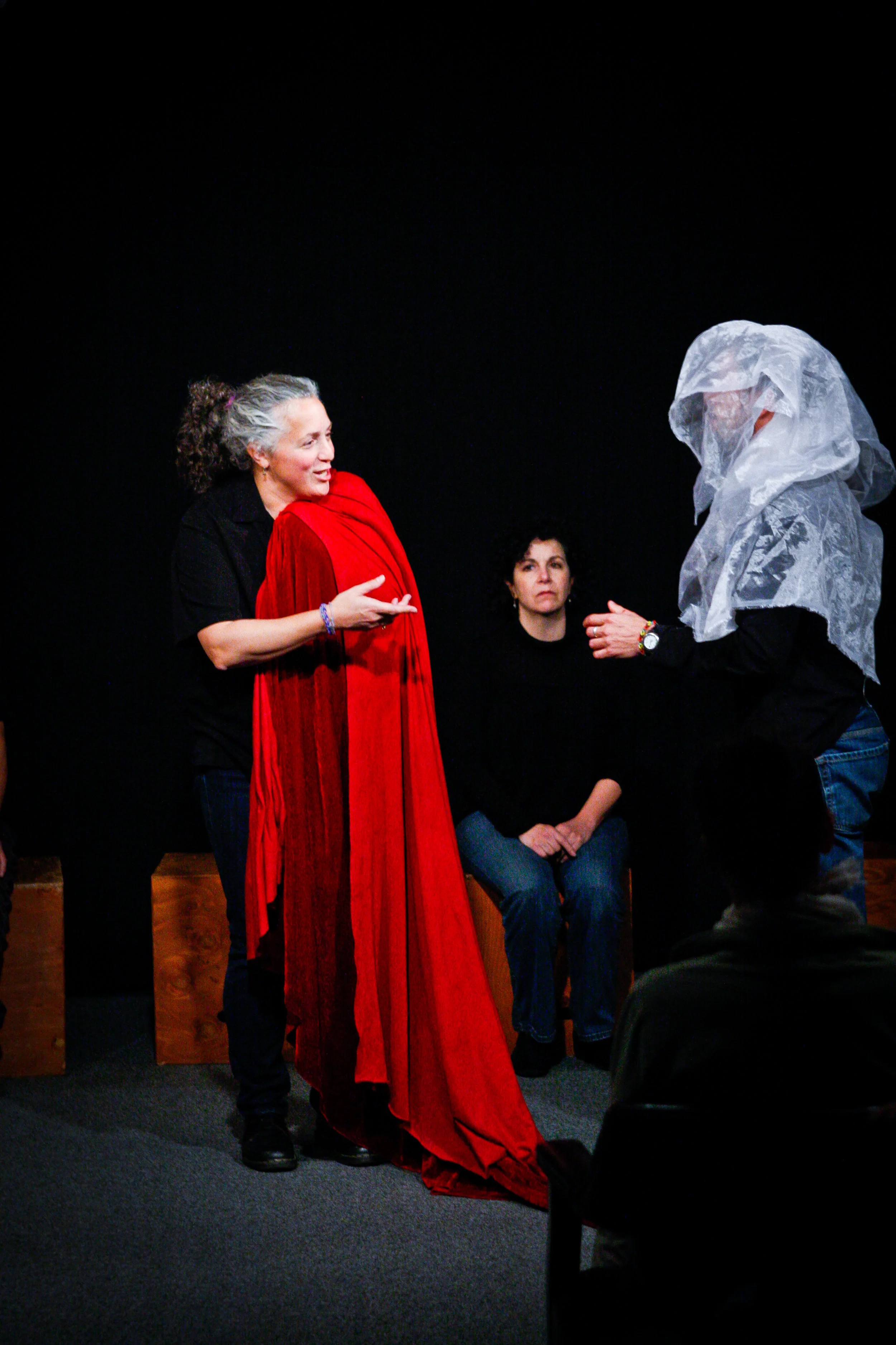 The cast uses only scarves as props