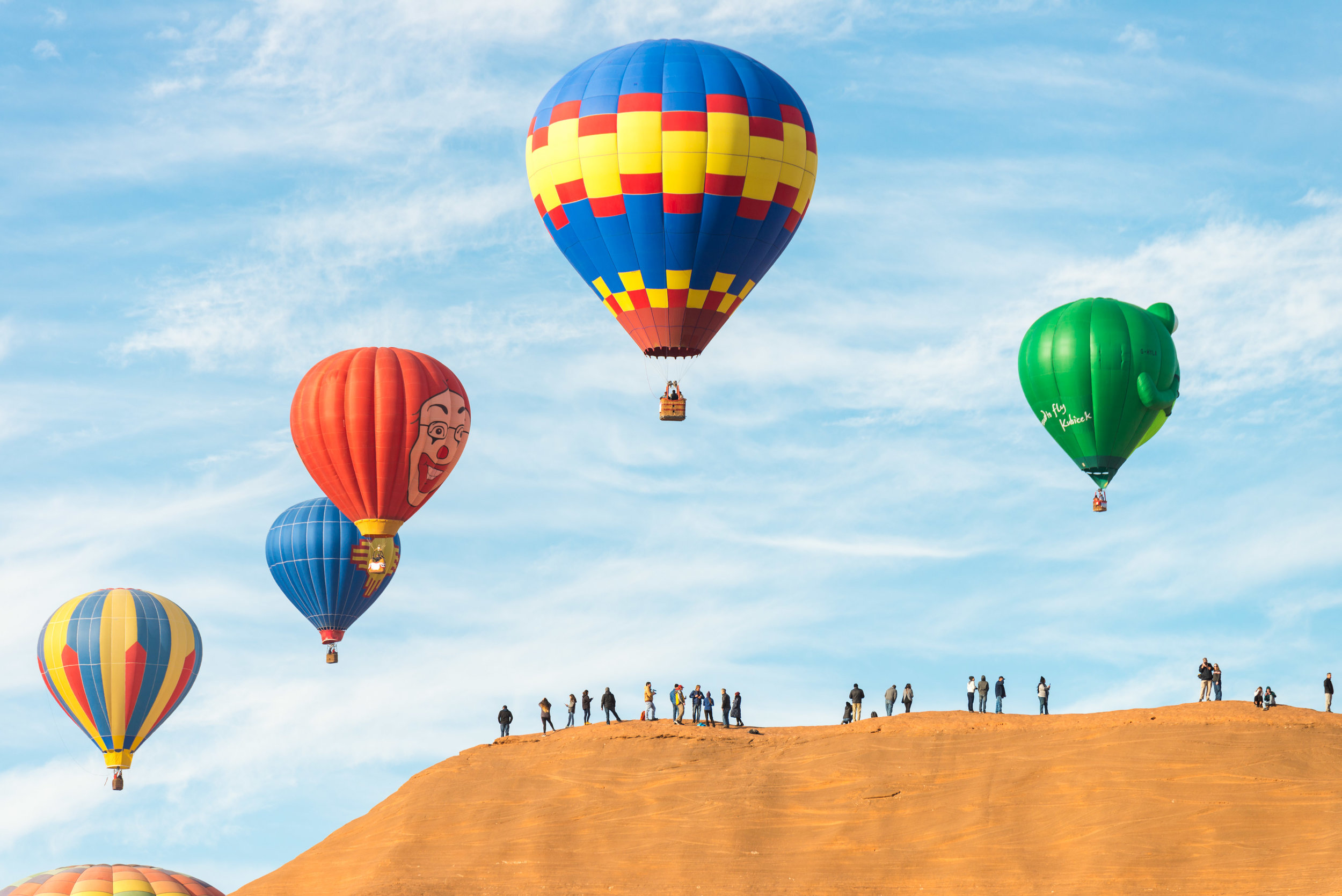 Shot at 200mm. If there are any substantial landmarks near the launch site, a telephoto lens is able to capture both the balloon and the landmark in great detail.