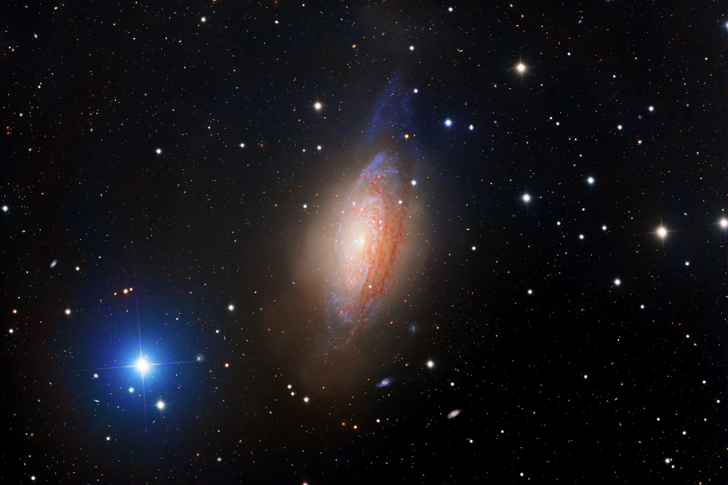 NGC 3521 is a nearby spiral galaxy about 35 million light-years away in the constellation Leo, notable for looking both familiar and oddly unsettled at the same time. At first glance it resembles a classic spiral, but closer inspection reveals chaoti