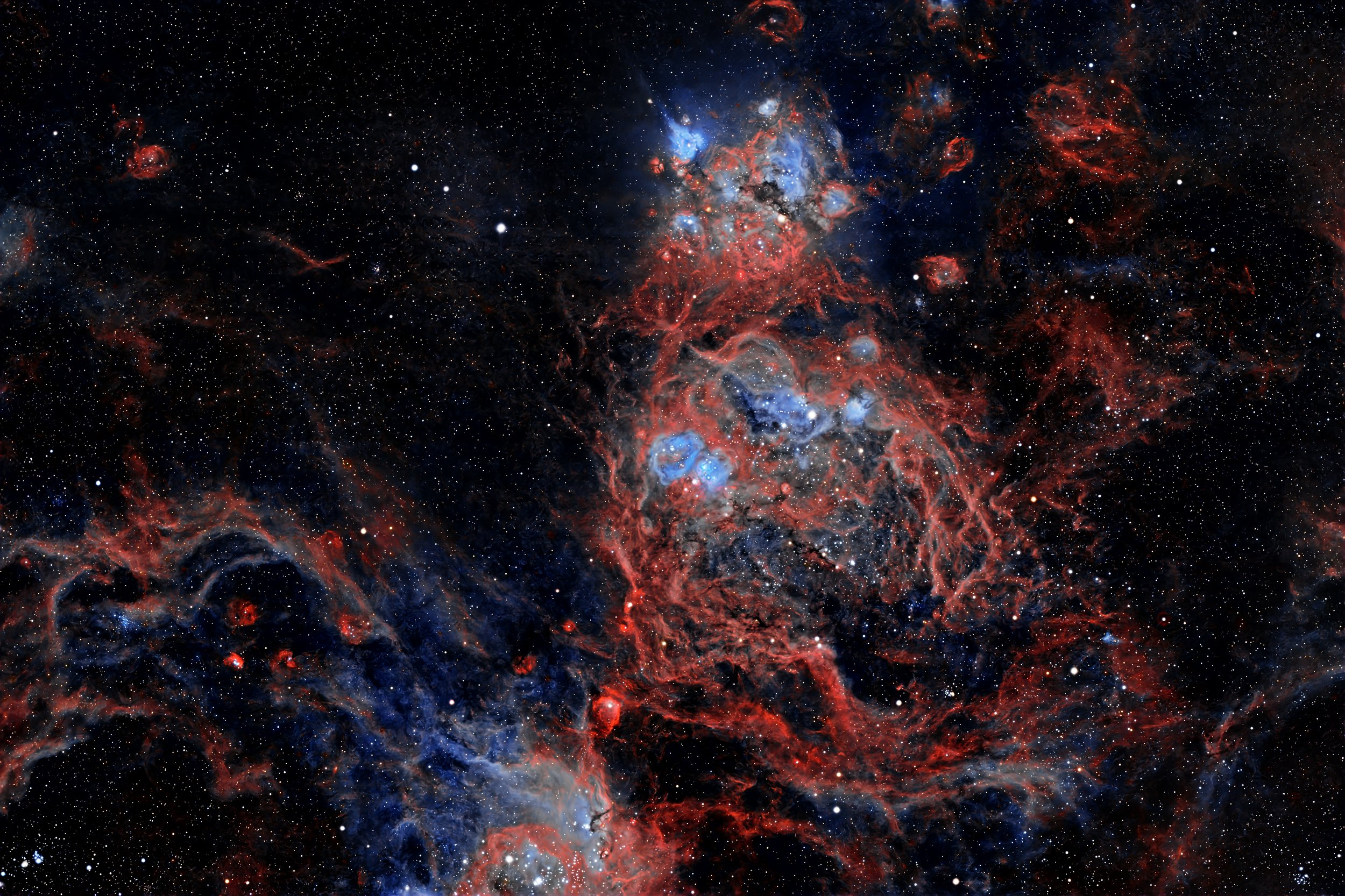 NGC 2077: A Star-Forming Region in the Large Magellanic Cloud.

It is an emission nebula about 170,000 light-years from earth.  The nebulae in NGC 2077 glow due to the ionization of gases, primarily hydrogen and oxygen, by the intense radiation from 