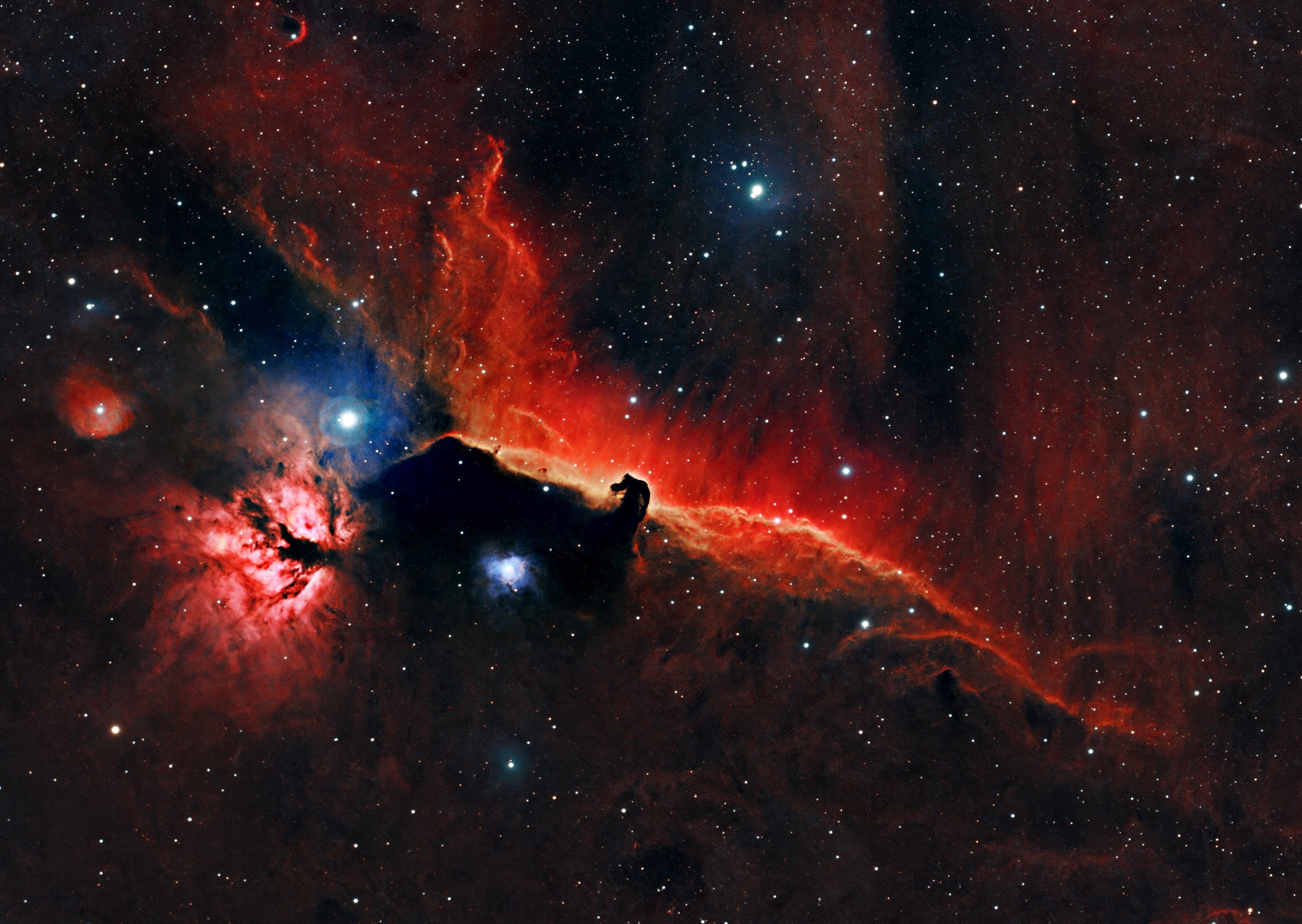 The Horsehead Nebula, B33, is a dark, cold, and dense cloud of gas and dust that blocks light from the emission nebula, IC 434, behind it. This creates the silhouette of a horse's head that makes the nebula so distinct. The background emission nebula