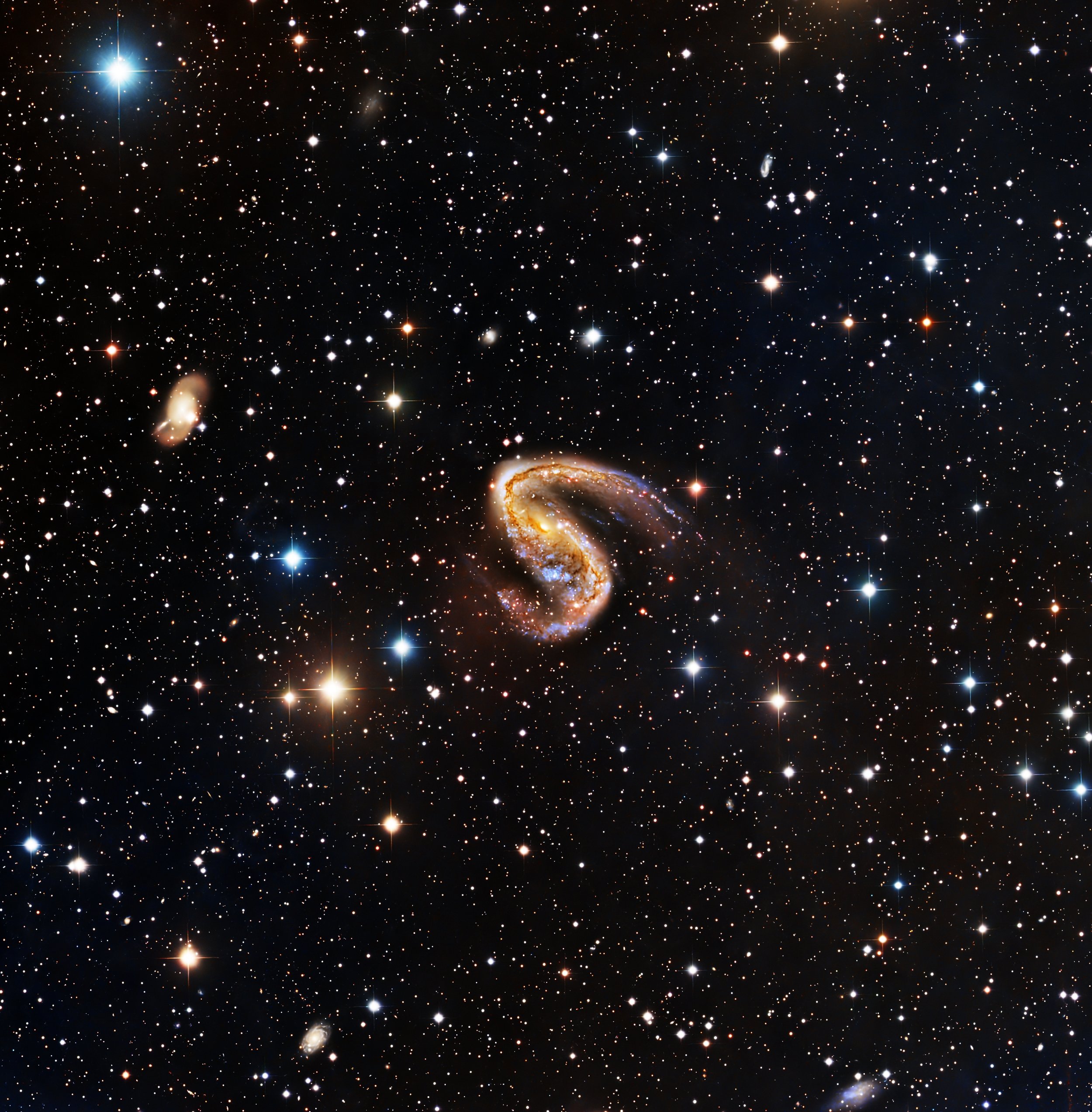 NGC 2442, often called the Meathook Galaxy, is a highly distorted spiral galaxy about 50–55 million light-years away in the southern constellation Volans. Its most striking feature is a wildly asymmetric spiral structure: one arm is stretched and tig