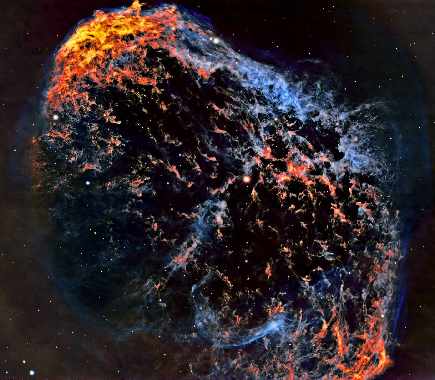 NGC 6888 is a striking Wolf–Rayet nebula about 4,700 light-years away in the constellation Cygnus. It was created by powerful stellar winds from the massive WR 136, which are colliding with slower material the star expelled earlier in its life. The r