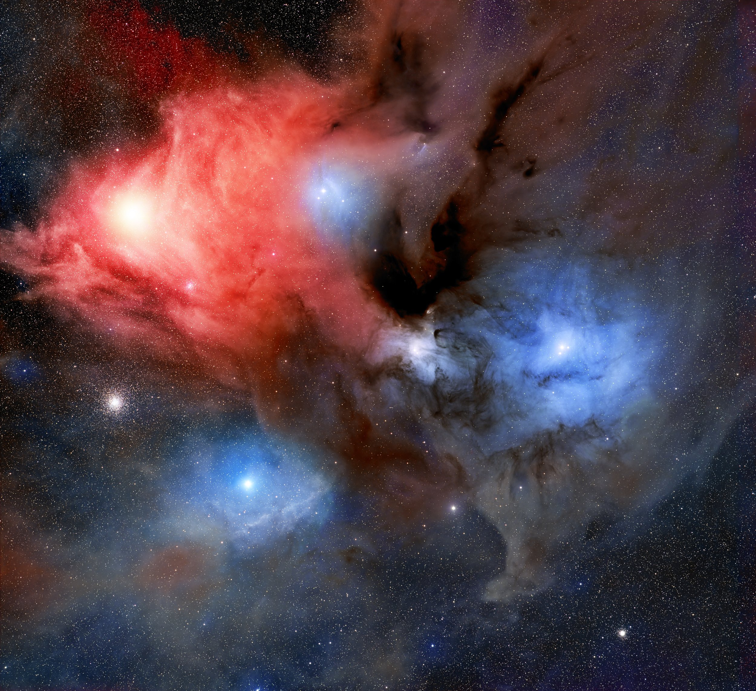 The Rho Ophiuchi cloud complex is one of the closest and most colorful star-forming regions to Earth. Located approximately 460 light-years away, this region is a complex of different types of nebulae, including emission, reflection, and dark nebulae