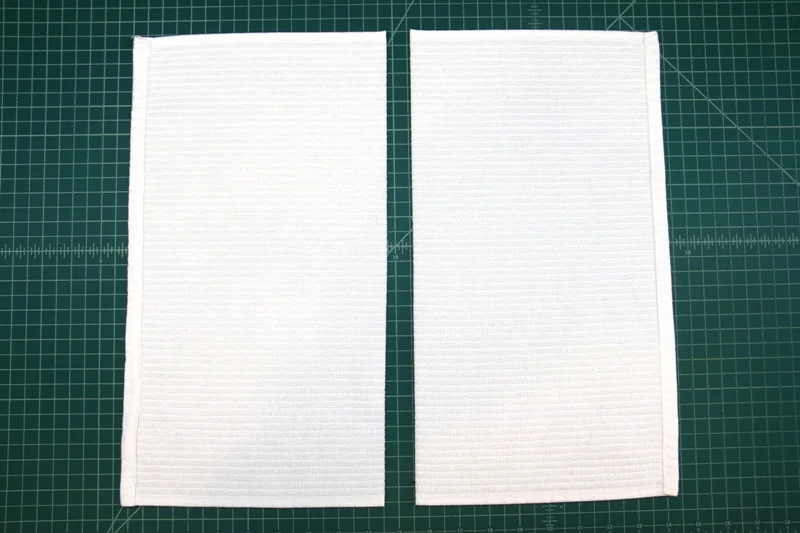 Cut dish towel in half