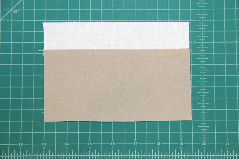 Sew hat brim to top of face piece