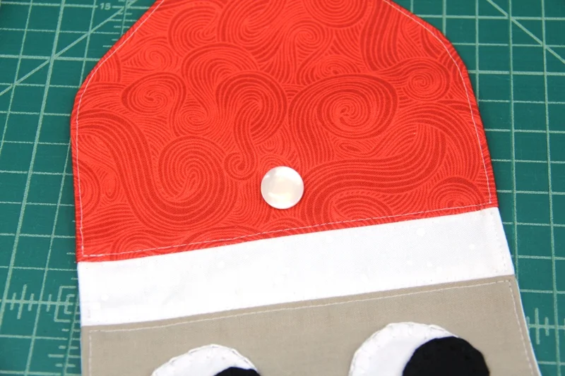 Button sewn on Santa hat