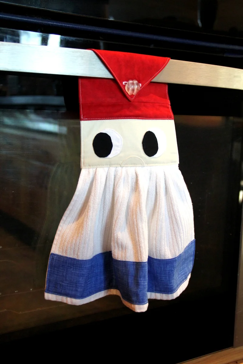 Gnome towel hanging on oven door