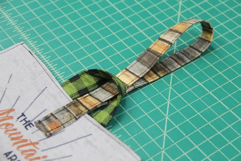 Handle pulled through loop