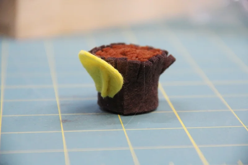 Glue first petal to center