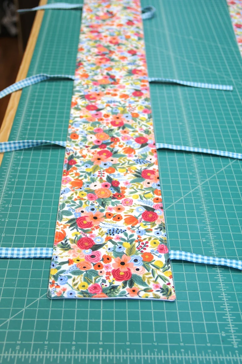 Topstitched rail guard