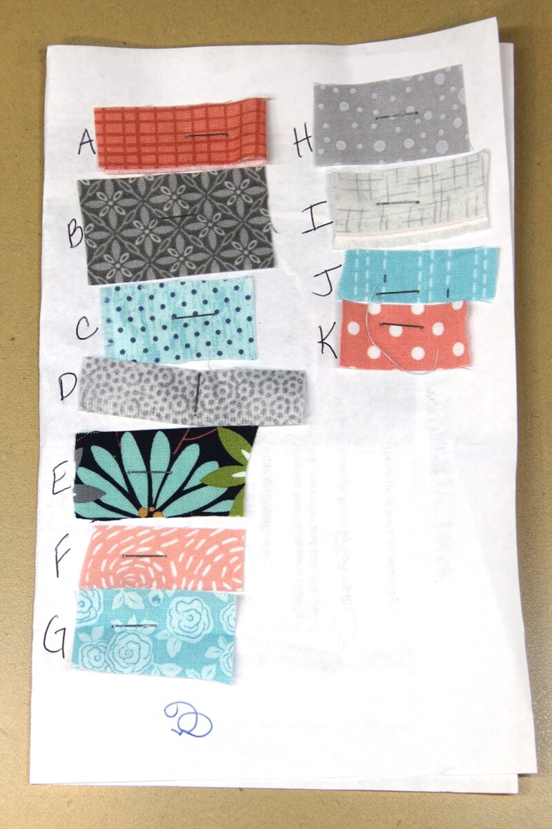 Fabric assigned to letters for quilt
