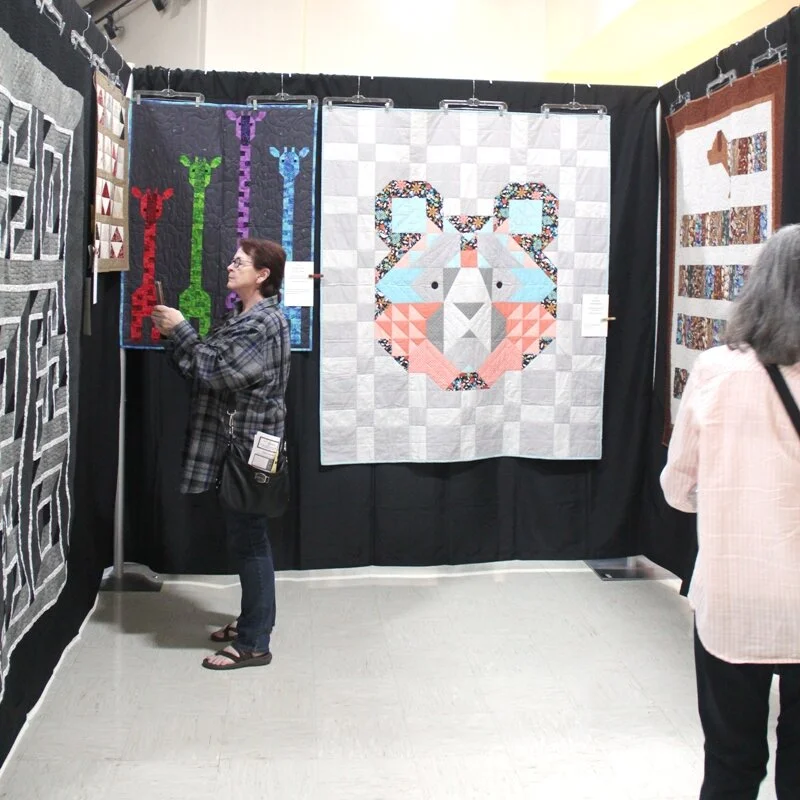 Big Sky Bear hanging at quilt show