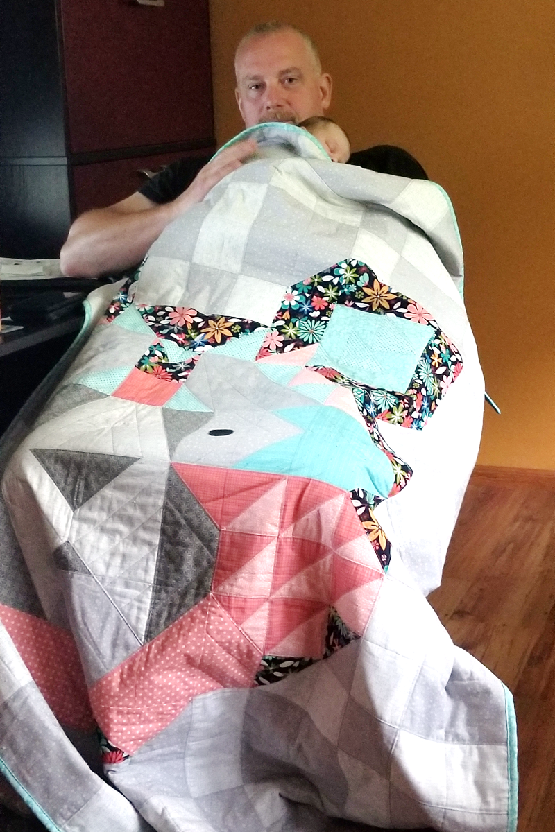 Snuggling under Big Sky Bear quilt