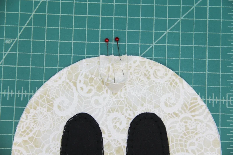 Hanging loop pinned in place