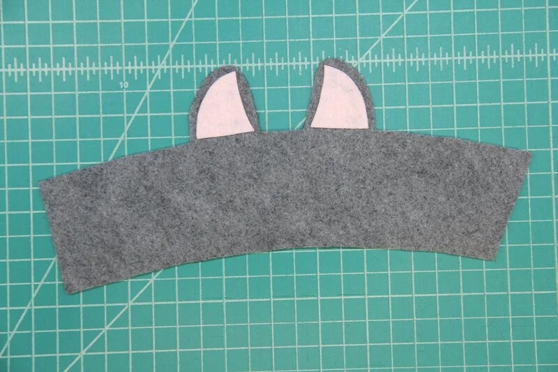 Inner ears glued into llama coffee cozy