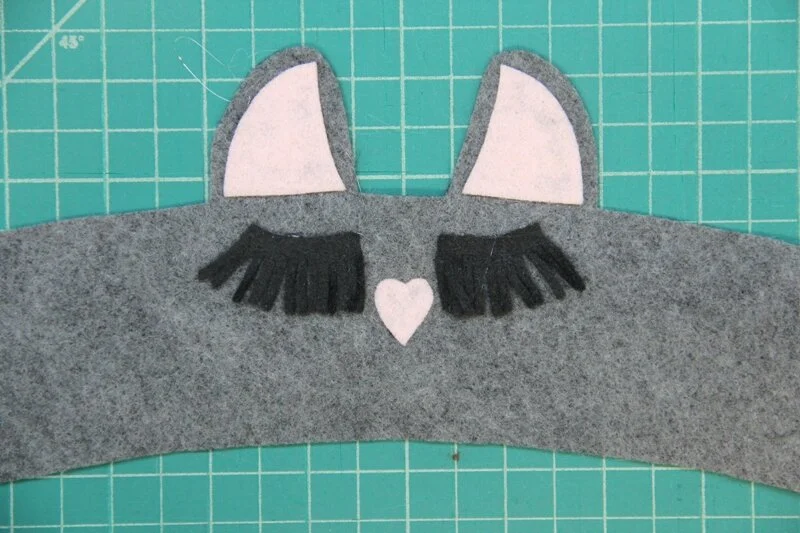 Nose glued onto llama coffee cozy